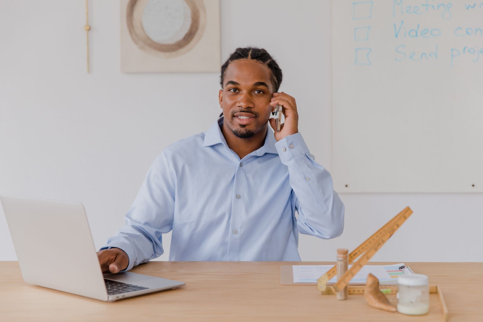 Staff member approving an AI-drafted quote on his phone, AI for flooring stores with a human in the loop